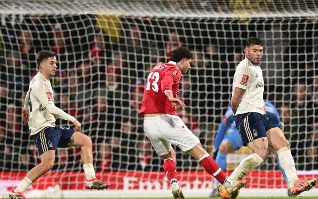 Wrexham's New Zealand defender Liberato Cacace scores the opening goal for Wrexham in their FA Cup third round win over Nottingham Forest in Wrexham, on January 9, 2026. (Photo by Oli SCARFF / AFP) / RESTRICTED TO EDITORIAL USE. NO USE WITH UNAUTHORIZED AUDIO, VIDEO, DATA, FIXTURE LISTS, CLUB/LEAGUE LOGOS OR 'LIVE' SERVICES. ONLINE IN-MATCH USE LIMITED TO 120 IMAGES. AN ADDITIONAL 40 IMAGES MAY BE USED IN EXTRA TIME. NO VIDEO EMULATION. SOCIAL MEDIA IN-MATCH USE LIMITED TO 120 IMAGES. AN ADDITIONAL 40 IMAGES MAY BE USED IN EXTRA TIME. NO USE IN BETTING PUBLICATIONS, GAMES OR SINGLE CLUB/LEAGUE/PLAYER PUBLICATIONS. /