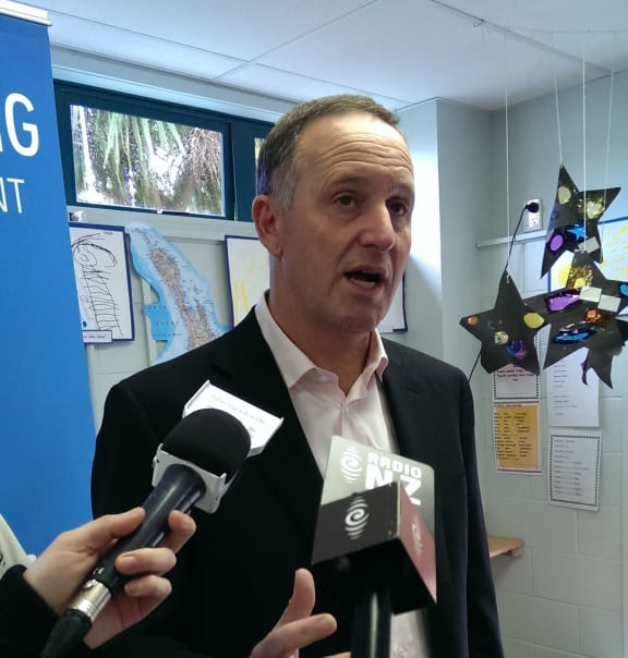 John Key talking to the media about poverty yesterday.