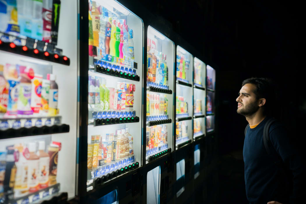 man at vending machine