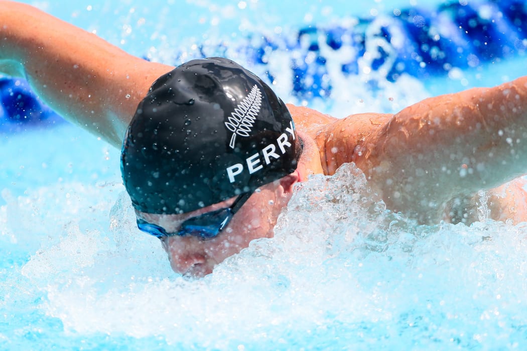 Sam Perry competing in the men's 50m butterfly heat.