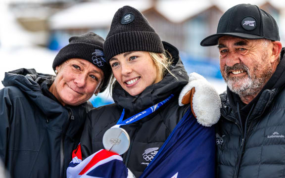 Zoi Sadowski-Synnott with her family after winning silver medal at the final of the Women's Snowboard Slopestyle, Winter Olympics, 2026.
