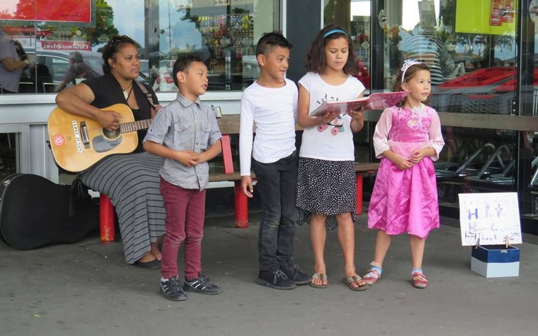 The kids out busking for Christmas charity.