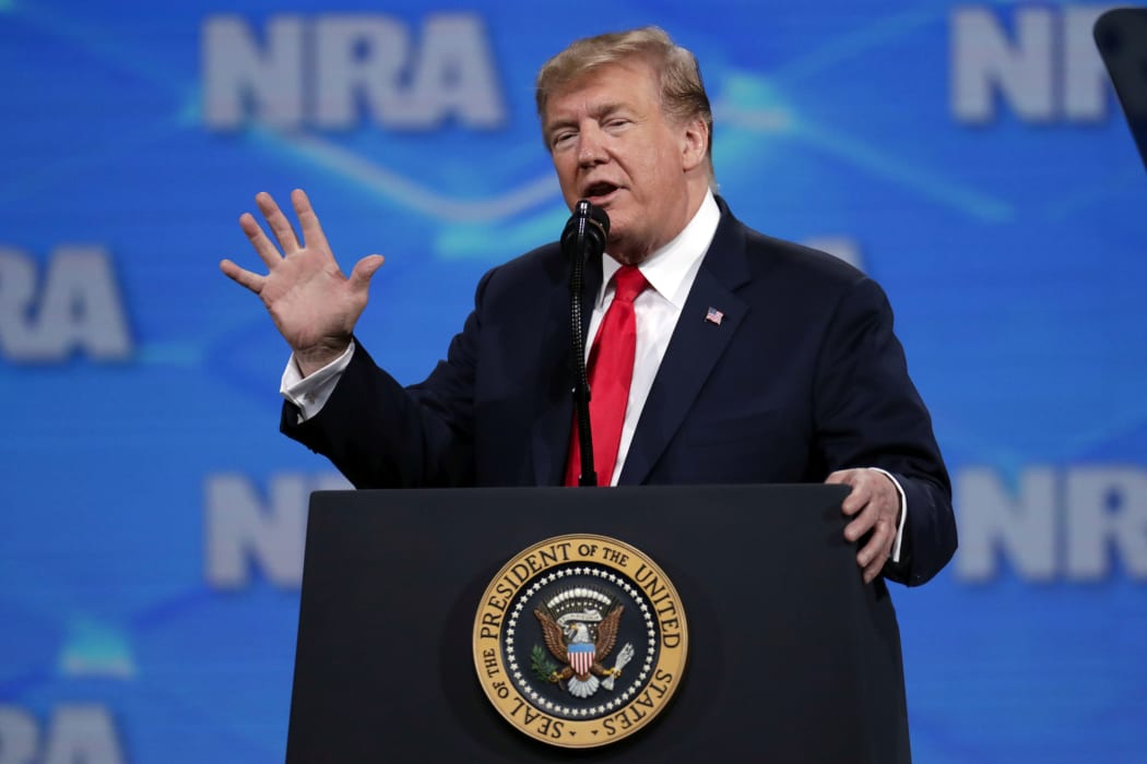 US President Donald Trump speaks at the National Rifle Association Institute for Legislative Action Leadership Forum in Lucas Oil Stadium in Indianapolis.