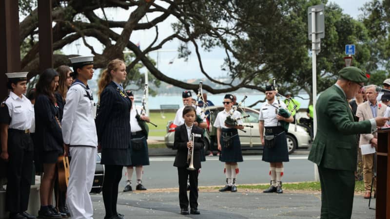 Celine waiting to perform at a Remembrance Service in 2024