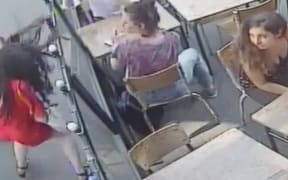 The man walked towards the student and was captured striking her on the cafe's video.