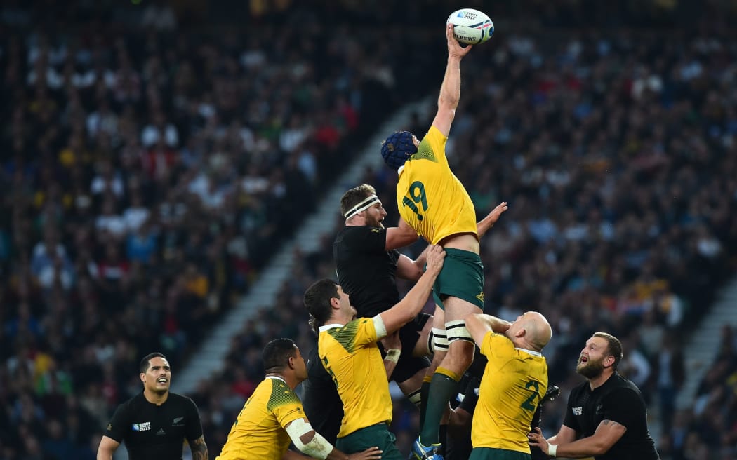 Australia's lock Dean Mumm catches the ball in a line out during the final match of the 2015 Rugby World Cup between New Zealand and Australia at Twickenham.