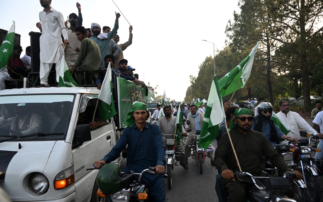 Demonstrators carrying Pakistan's national flags participate in an anti-India protest in Islamabad on May 10, 2025.