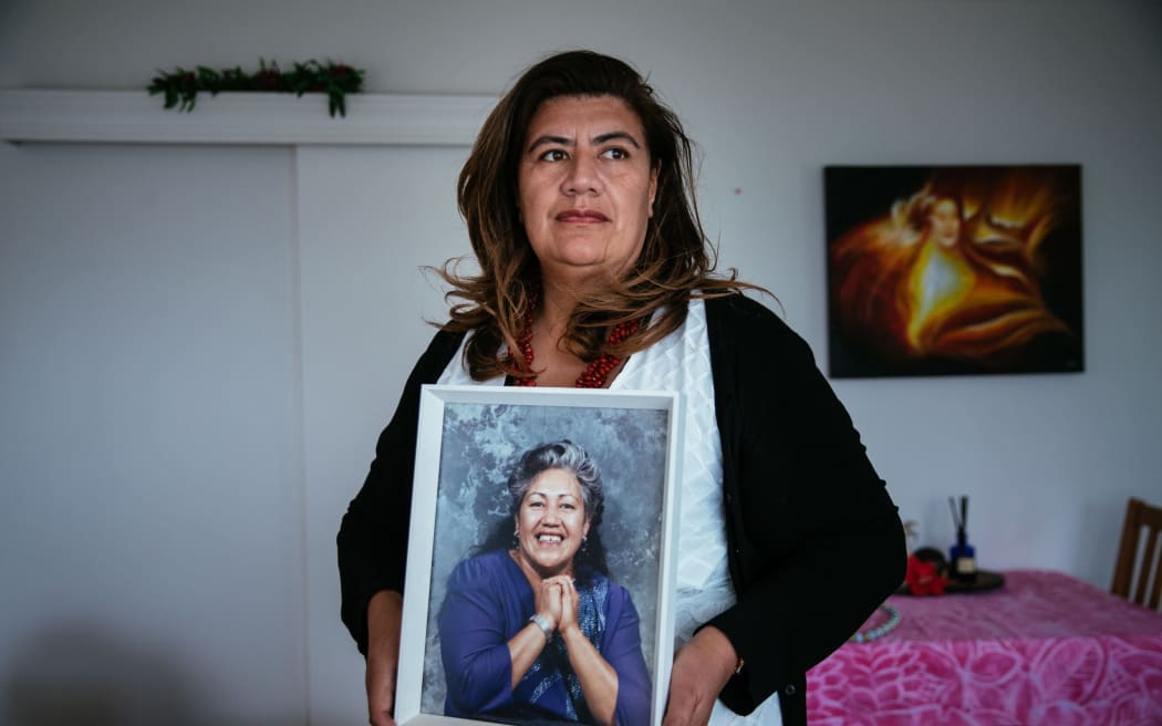 Auckland councillor Josephine Bartley with a picture of her mother Ruth, who she says had a chronic gambling problem which led to her eventually losing the family home.