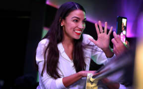 Alexandria Ocasio-Cortez celebrates her victory at La Boom night club in Queen.
