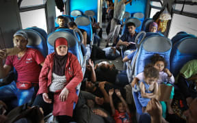 Refugees wait inside the train that will bring them to the capital Zagreb in Osijek, near Hungarian border in Croatia