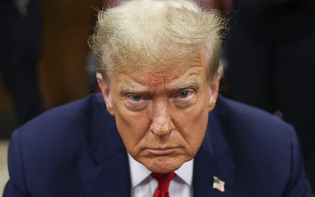 Former US President Donald Trump attends his trial for allegedly covering up hush money payments linked to extramarital affairs, at Manhattan Criminal Court in New York City on April 23, 2024. Trump faces a contempt of court hearing on Tuesday as part of his historic criminal trial, with New York prosecutors insisting the former president repeatedly violated the gag order issued to prevent him from intimidating witnesses. (Photo by Yuki Iwamura / POOL / AFP)