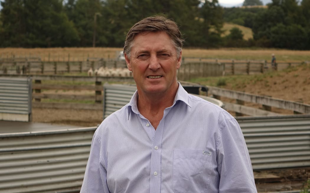 Mr Gately stands in front of milking she pens