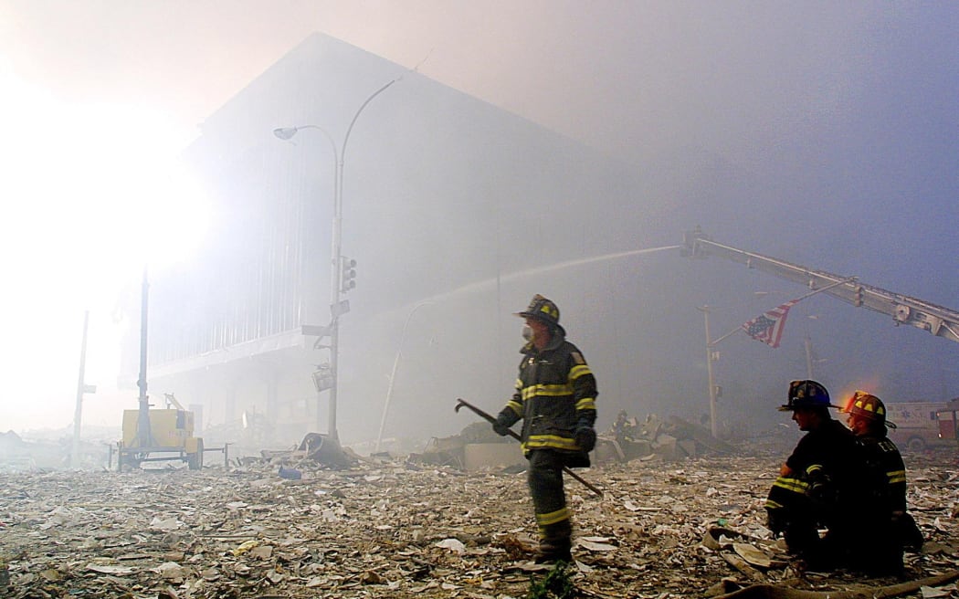 A New York firefighter works in the debris from the collapse of the twin Towers in 2001.