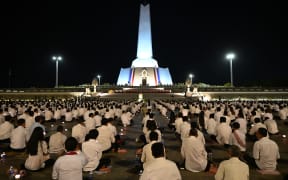 Participants attend a prayer for peace at Win-Win memorial in Phnom Penh on 29 December, 2025, after Thailand and Cambodia agreed to an "immediate" ceasefire on 27 December following renewed border clashes that killed dozens of people and displaced more than a million this month.