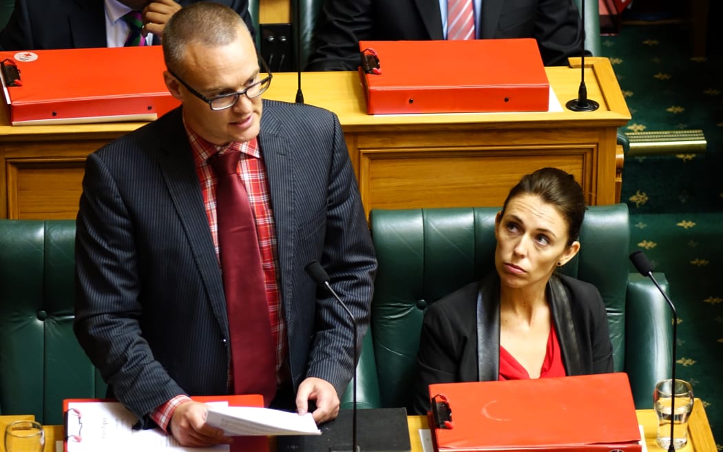 Labour MP Dr David Clark (left) and Labour MP Jacinda Ardern (right) in question time.