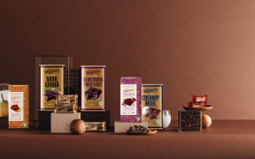 A line up of chocolate bars from Whittaker's, including Dark Ghana, Fruit & Nut, Creamy Milk, and Peanut Slab.