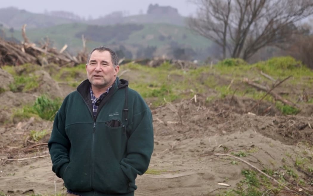 Dan Bergloff-Howes surveys the planting sites, mostly covered in silt.