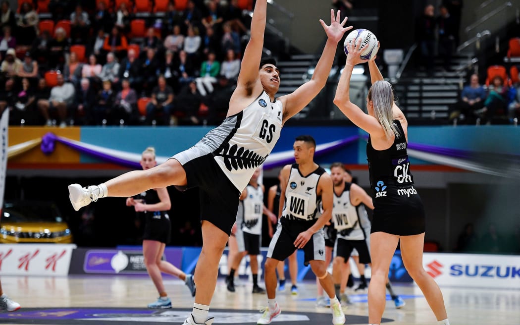 NZ Men's Junior Levi on defence against Silver Ferns Jane Watson.