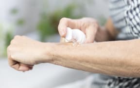 Woman 
Woman applying post-menopause hormone gel. 

COLLANGES / BSIP (Photo by COLLANGES / BSIP / BSIP via AFP)