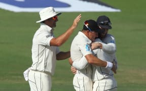 Ajaz Patel congratulated by team-mates.