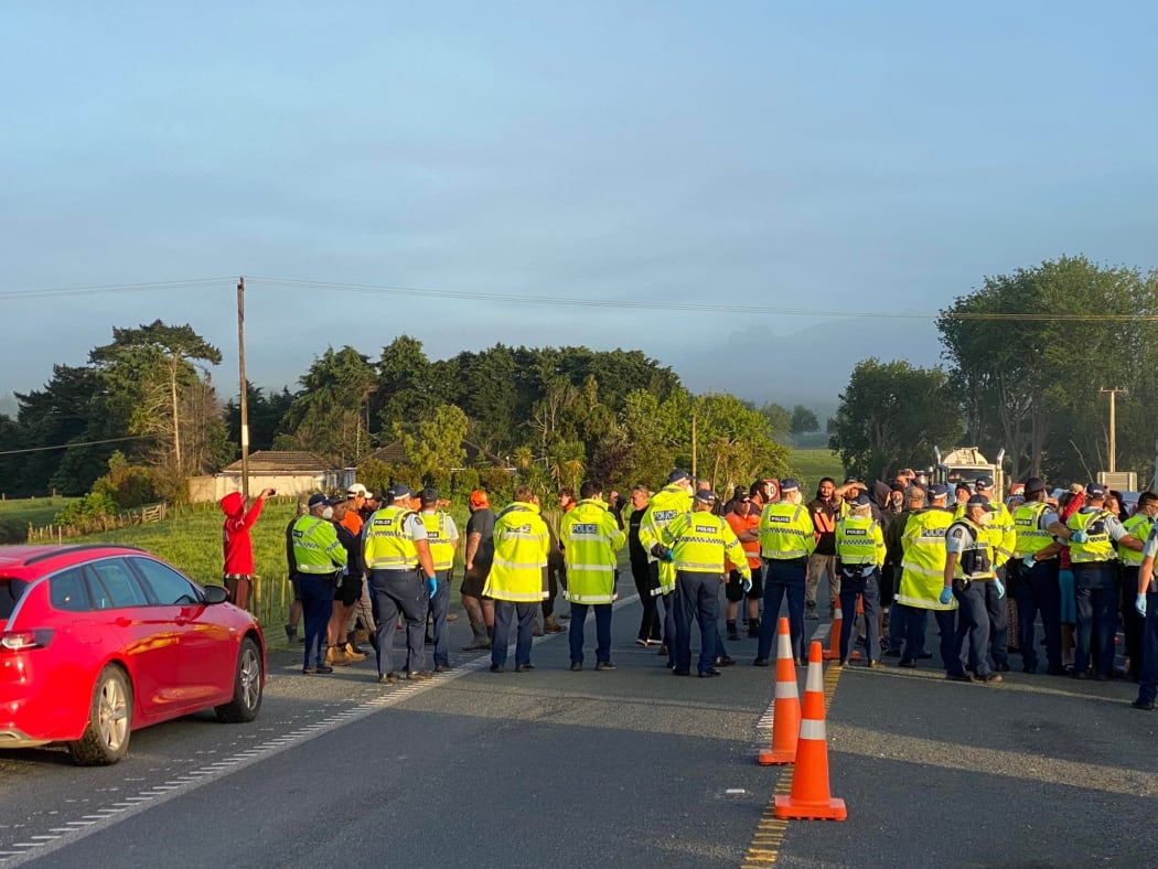 Protesters gathered at the northern side of Auckland's northern boundary on Tuesday morning.