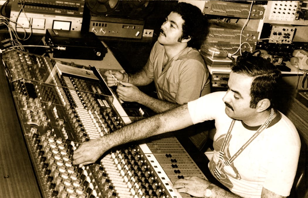 Henri Debs and Philippe Debs at the mixing desk during a 1970s session.