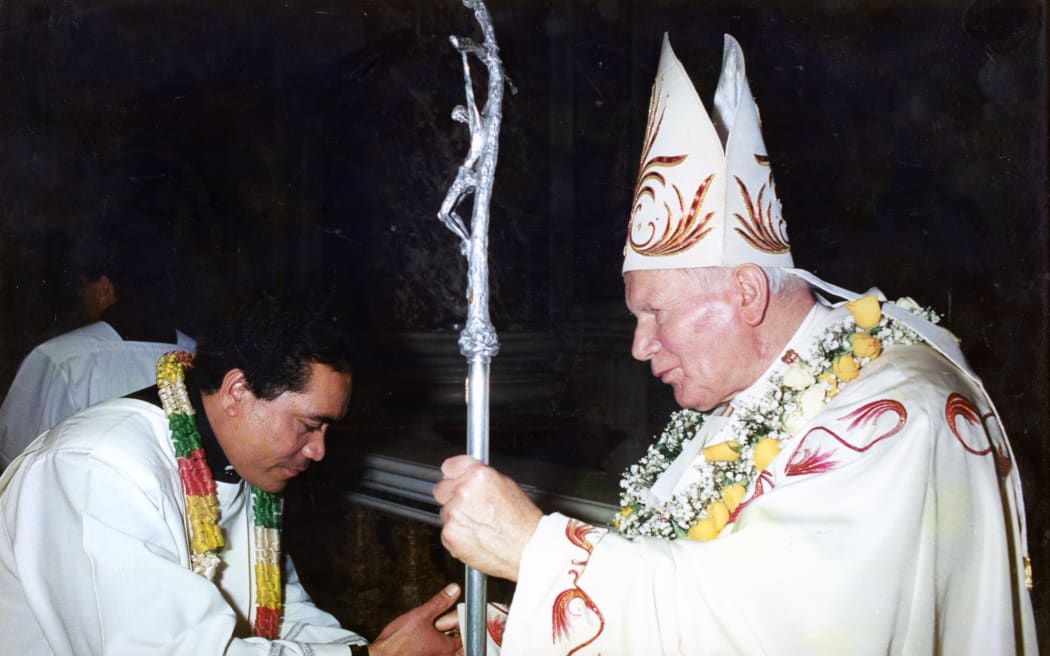 Father Paulo Sagato Filoialii and Pope John Paul II.