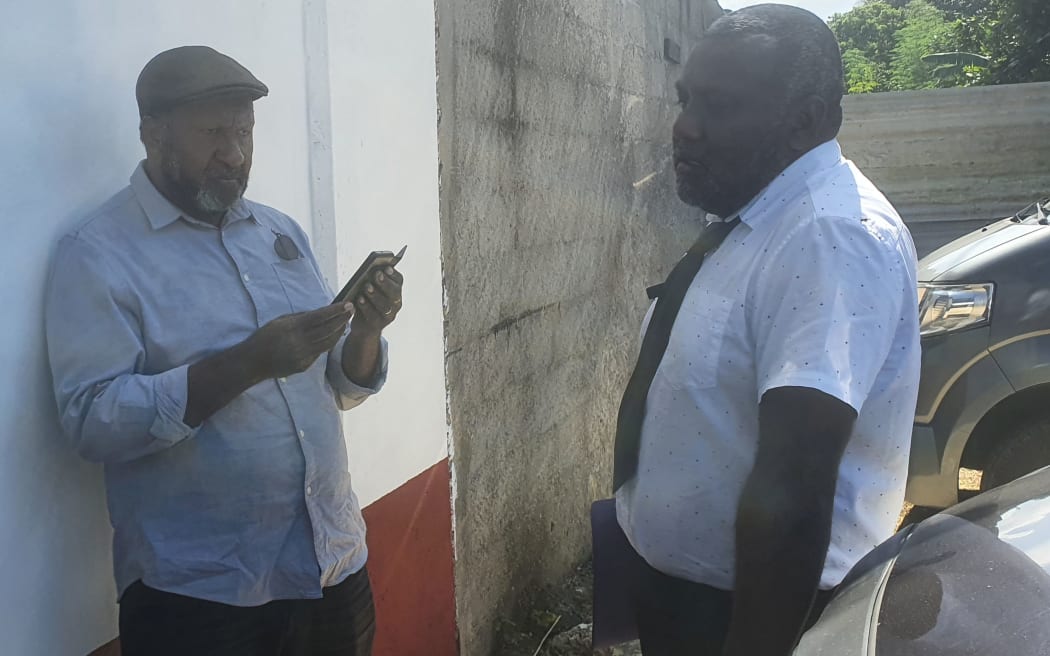 Former Vanuatu PM Charlot Salwai, (left), and lawyer Daniel Yahwah