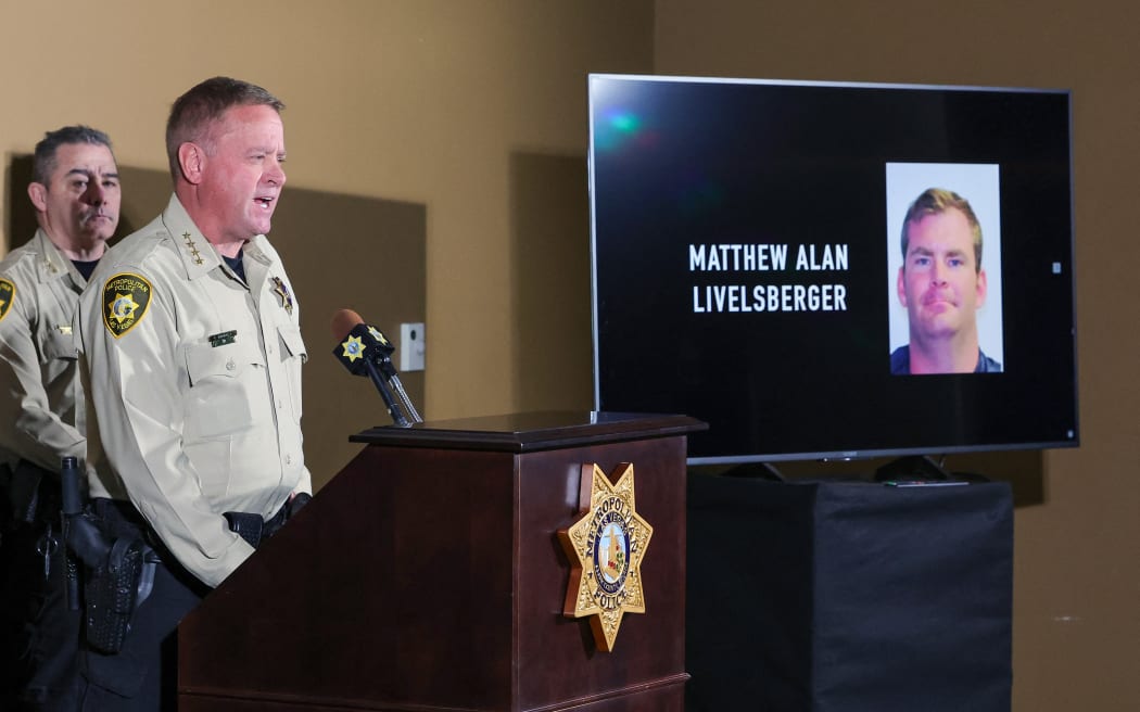 LAS VEGAS, NEVADA - JANUARY 02: An image of Matthew Alan Livelsberger driver’s license photo is displayed on a monitor as Las Vegas Metropolitan Police Department Sheriff Kevin McMahill speaks about the Tesla Cybertruck that exploded on New Year's Day in front of the entrance to the Trump International Hotel & Tower Las Vegas during a news conference at LVMPD headquarters on January 02, 2025 in Las Vegas, Nevada. McMahill said that authorities believe the person of interest in the incident is Livelsberger, a 37-year-old active member of the U.S. military, but are waiting for the coroner to make the final determination. McMahill also said the driver suffered a gunshot wound to the head that is believed to have been self-inflicted.   Ethan Miller/Getty Images/AFP (Photo by Ethan Miller / GETTY IMAGES NORTH AMERICA / Getty Images via AFP)