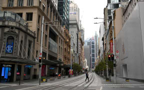 Near-deserted streets are seen in the central business district as people stay home due to the COVID-19 novel coronavirus outbreak in Sydney on March 30, 2020. - Australia has recorded almost 4,000 cases of the coronavirus, COVID-19, with the death toll rising to 17 as of March 30.