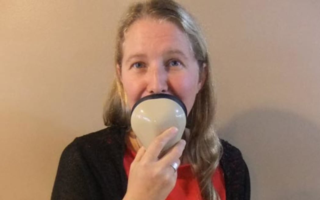 Audio Descripber Nicola Owen talks into a stenomask.