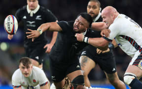 Asafo Aumua offloads under pressure.