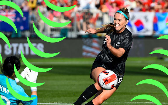 Football Fern Gabbi Rennie wheels away as their strike sails into the goal with a sunlight crowd in the background