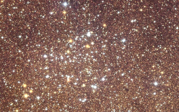 A handout image released on June 23, 2026 by the European Space Agency and taken on March 23, 2025 for a period of 26 hours by the Euclid’s optical camera VIS to wich  the colours were added using observations captured in the summer of 2025 with the Canada-France-Hawaii Telescope’s MegaCam camera (CFHT-Megacam) in Hawaii shows our Milky Way galaxy’s centre. 60 million stars, billions of visible galaxies and image quality never seen before: on June 24, 2026, the European Space Agency (ESA) unveiled the centre of the Milky Way, which should enable the identification of new exoplanets. (Photo by Handout / EUROPEAN SPACE AGENCY / AFP) / RESTRICTED TO EDITORIAL USE - MANDATORY CREDIT "AFP PHOTO /  HANDOUT  / EUROPEAN SPACE AGENCY" - HANDOUT - NO MARKETING NO ADVERTISING CAMPAIGNS - DISTRIBUTED AS A SERVICE TO CLIENTS