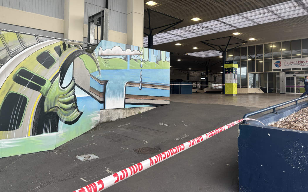 Emergency tape blocking the entrances to Lower Hutt’s Waterloo Station. Police officers are stationed.