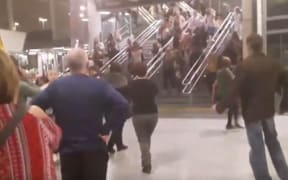 People vacate Manchester Arena following the reports of explosions.
