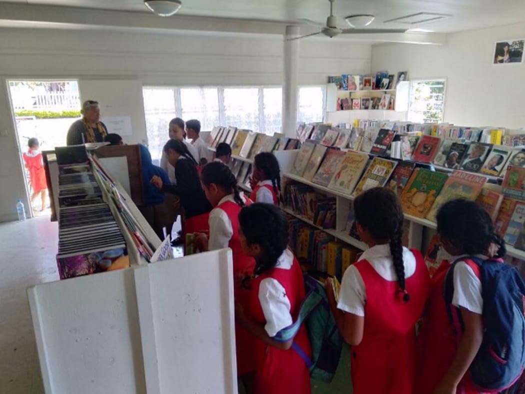 Children with books in Tonga
