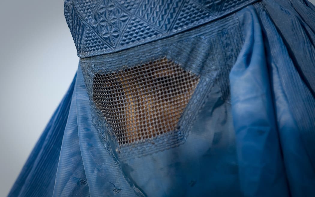 A woman in a burqa in the old city of Kabul.