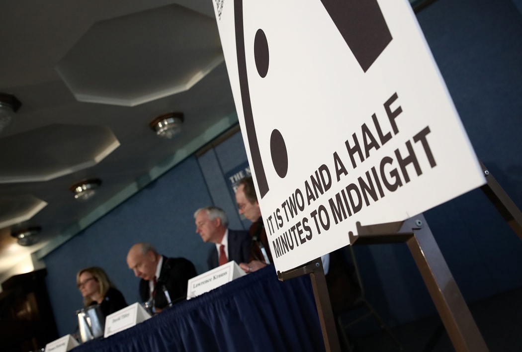 Members of the Bulletin of Atomic Scientists unveil the 2017 time for the "Doomsday Clock" on January 26, 2017 in Washington, DC.