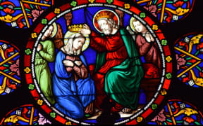 Stained glass image depicting Mary's Coronation
