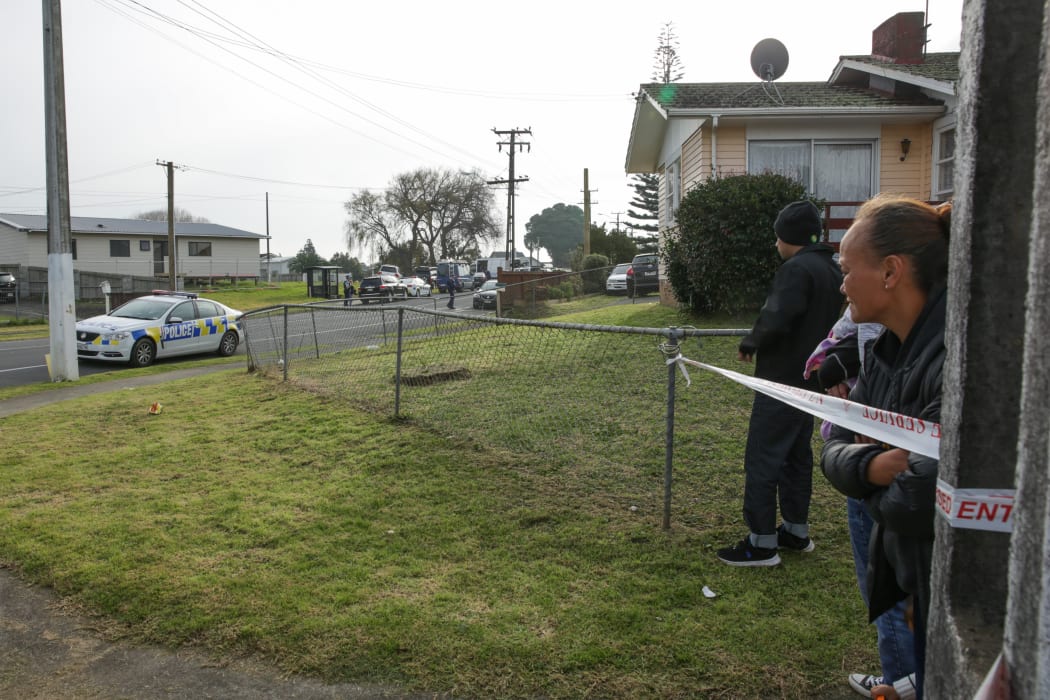 Residents wait to be allowed back to their homes.