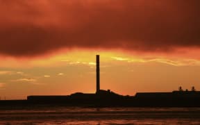 21586193 - a vibrant sunrise overlooking bluff aluminium smelter new zealand