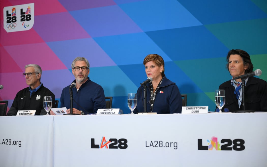 (From L) LA28 and International Olympic Committee officials Reynold N. Hoover, Casey Wasserman, Nicole Hoevertsz and Christophe Dubi attend a LA28 and International Olympic Committee news conference on preparations for the 2028 Games at the JW Marriott L.A. Live in Los Angeles on June 4, 2026. (Photo by Patrick T. Fallon / AFP)