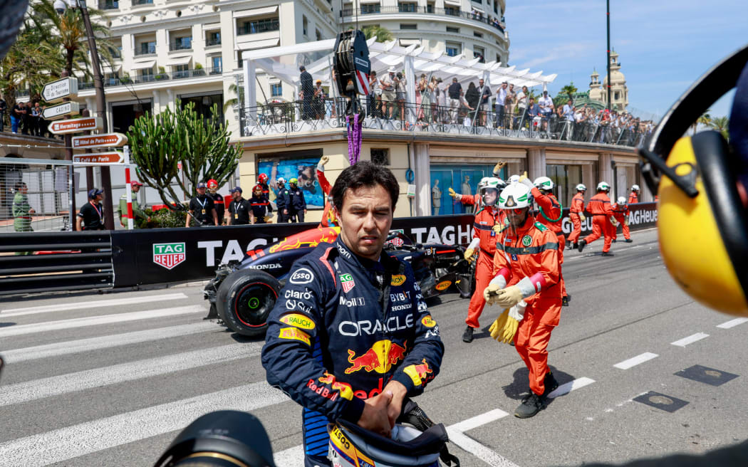 Sergio Perez of Red Bull walks away from his crash at Monaco, 2024.