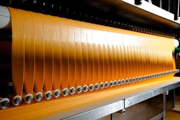 Fonterra Foodservice slice-on-slice cheese during production at Eltham.