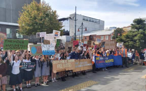 Protesters outside the council building in Christchurch chant "Mayor Dalziel" and "where's our mayor?" Councillors attempted to speak, but were drowned out by the crowd calling for the mayor.