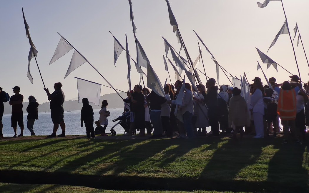 Hundreds of protesters arrive at Waitangi for Tame Iti's white flag protest.