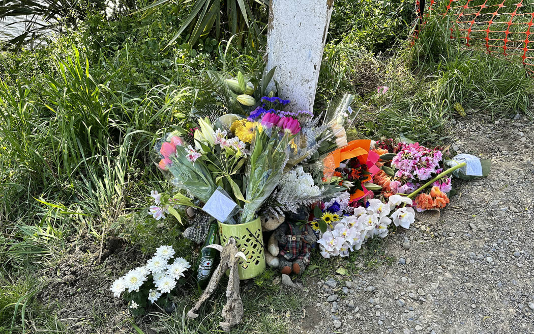 Flowers left at the scene of a fatal accident, where 3 people died, at the intersection of SH1 and Bush road in Tuamarina near Blenheim.