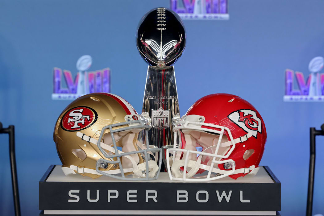 LAS VEGAS, NEVADA - FEBRUARY 05: A general view of the Vince Lombardi Trophy with the San Francisco 49ers and Kansas City Chiefs helmets during a press conference ahead of Super Bowl LVIII at Allegiant Stadium on February 05, 2024 in Las Vegas, Nevada.   Ethan Miller/Getty Images/AFP (Photo by Ethan Miller / GETTY IMAGES NORTH AMERICA / Getty Images via AFP)