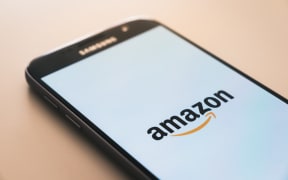 The Amazon logo on a mobile phone